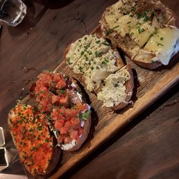 Postino WineCafe signature dishes Bruschetta Board, Greek Hummus Board, Nick's Board.